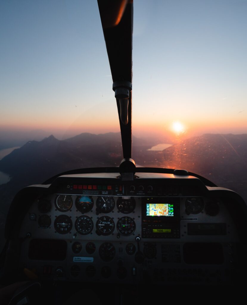 View out of small Airplane during Sunset